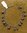 chromen armbandje met kunststof parels ± 25 cm